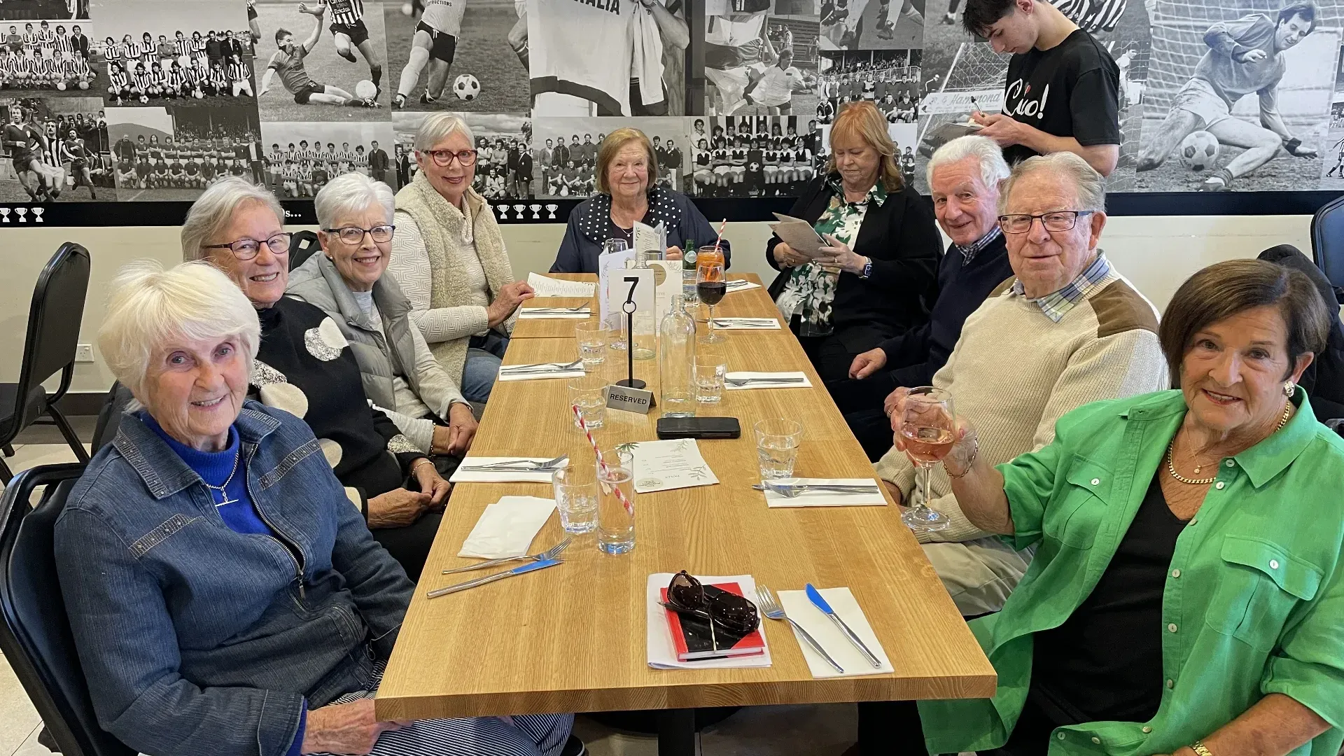 Members sitting at a dining table